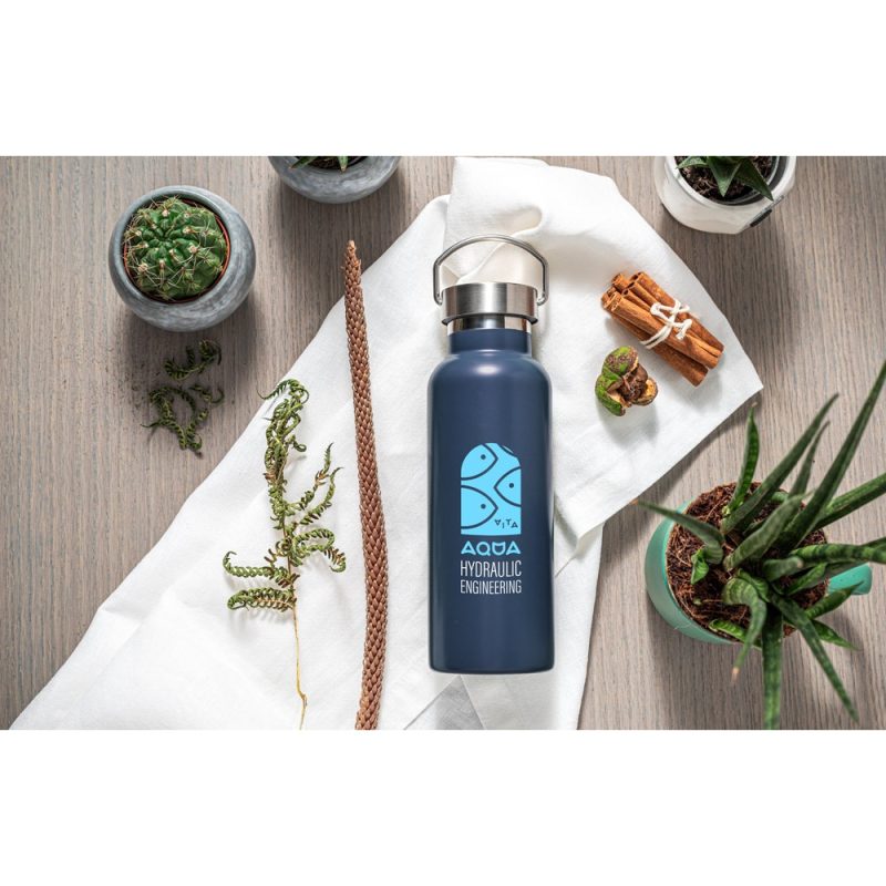 Eco-friendly water bottle with green plants and cinnamon.