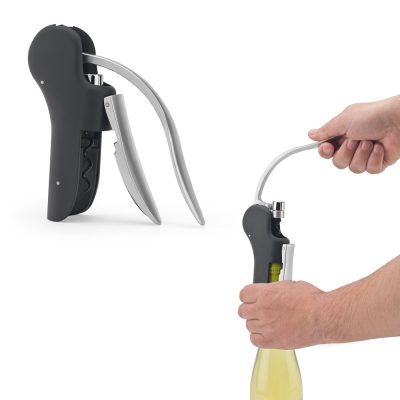 Lever corkscrew opening wine bottle.