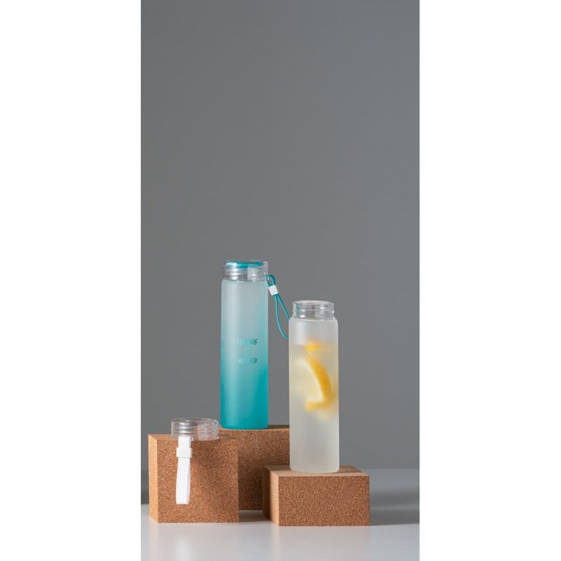 Two stylish water bottles on cork pedestals.