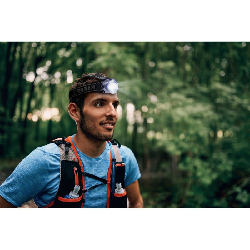 Man wearing headlamp for outdoor adventure