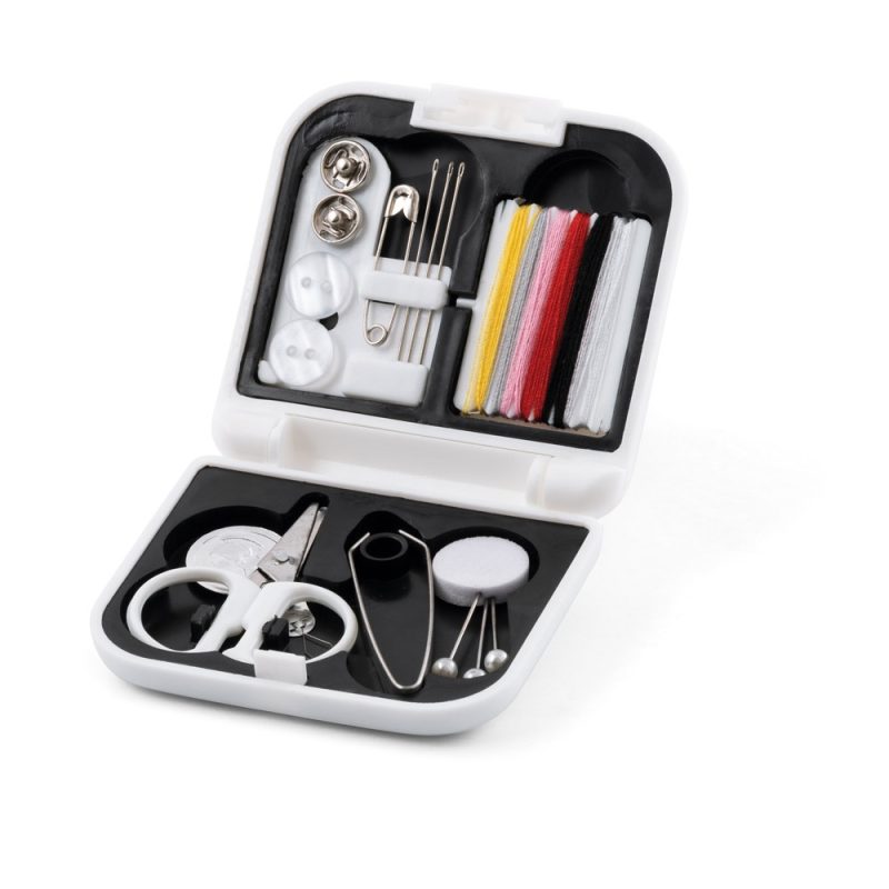 Compact sewing kit with thread and tools.