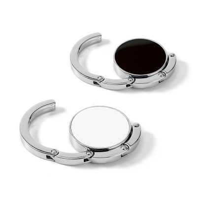Two circular handbag hooks, black and white.
