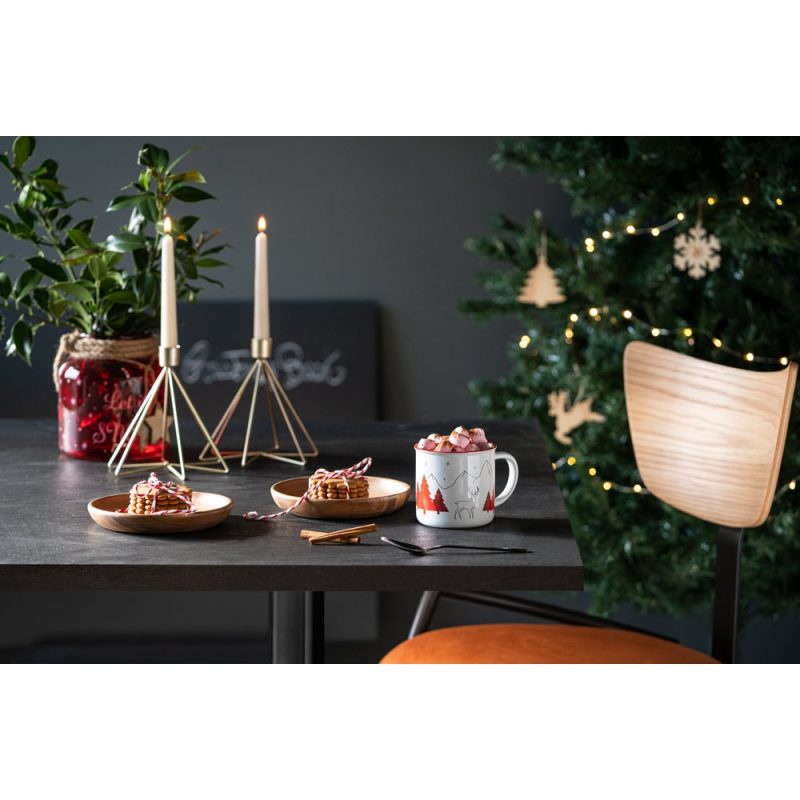 Festive table setting with candles and tree
