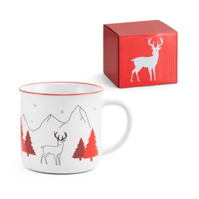 Christmas mug with deer, trees, and mountains design.