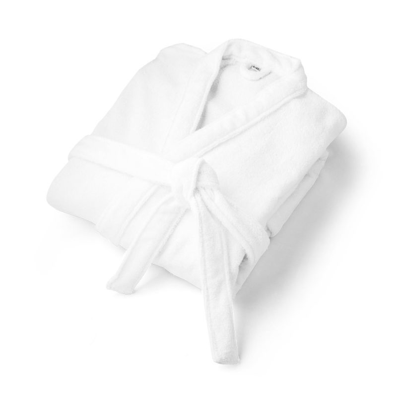 White cotton bathrobe folded neatly.