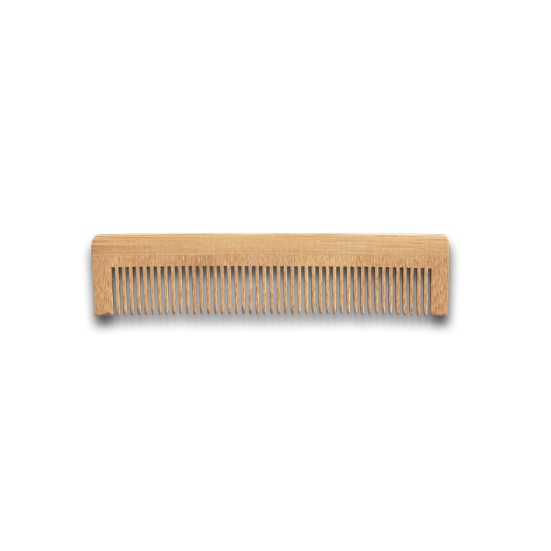 Wooden comb isolated on white background.