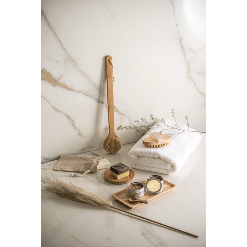 Eco-friendly bathroom products on marble surface.
