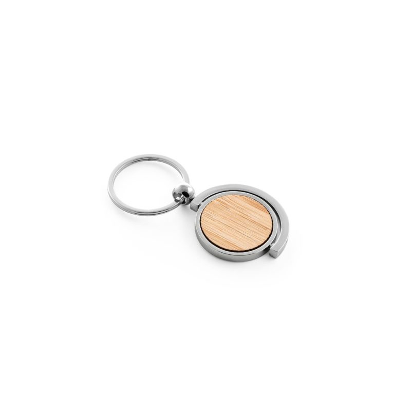 Metal and bamboo keyring on white background.