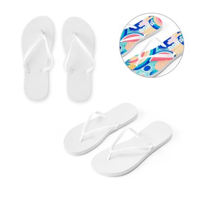 White flip-flops with colourful print underfoot.