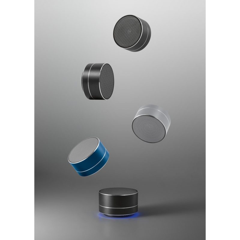 Floating modern wireless speakers on grey background