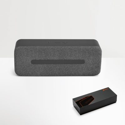 Grey wireless speaker with packaging box.