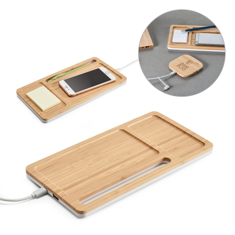 Bamboo charging station with smartphone and accessories.