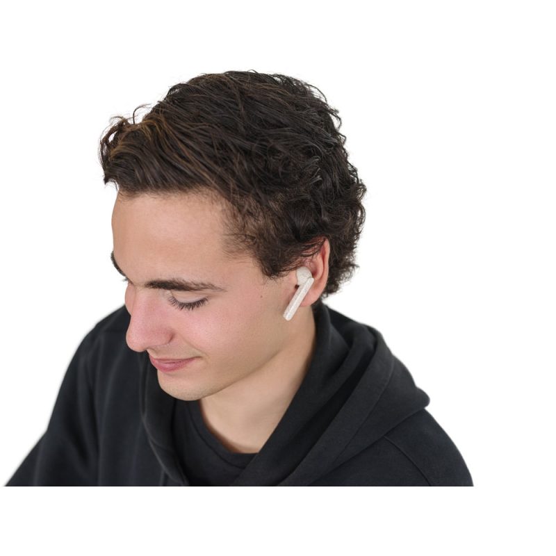 Man wearing white earbud and black hoodie.